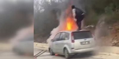 Bursa’de Otomobil alev topuna döndü, canını hiçe sayıp yangını söndürmeye çalıştı