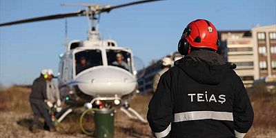 Helikopterle 170 bin voltluk elektrik hattı üzerinde havada asılı mesai yapıyorlar