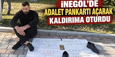 İNEGÖL’DE ADALET PANKARTI AÇARAK KALDIRIMA OTURDU
