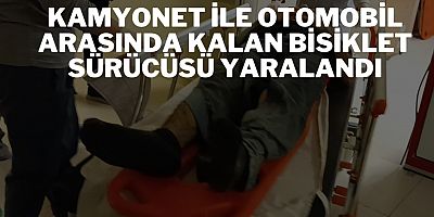 Kamyonet ile otomobil arasında kalan bisiklet sürücüsü yaralandı