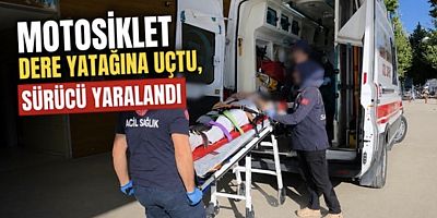Motosiklet Dere Yatağına Uçtu, Sürücü Yaralandı