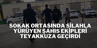 Sokak ortasında silahla yürüyen şahıs ekipleri teyakkuza geçirdi