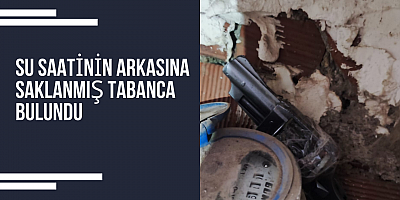 Su saatinin arkasına saklanmış tabanca bulundu